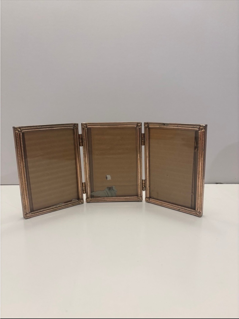 Vintage ornate golden color tri fold picture frame